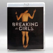 Breaking the Girls Blu-Ray cover featuring a restrained woman from the back with title text on a dark background