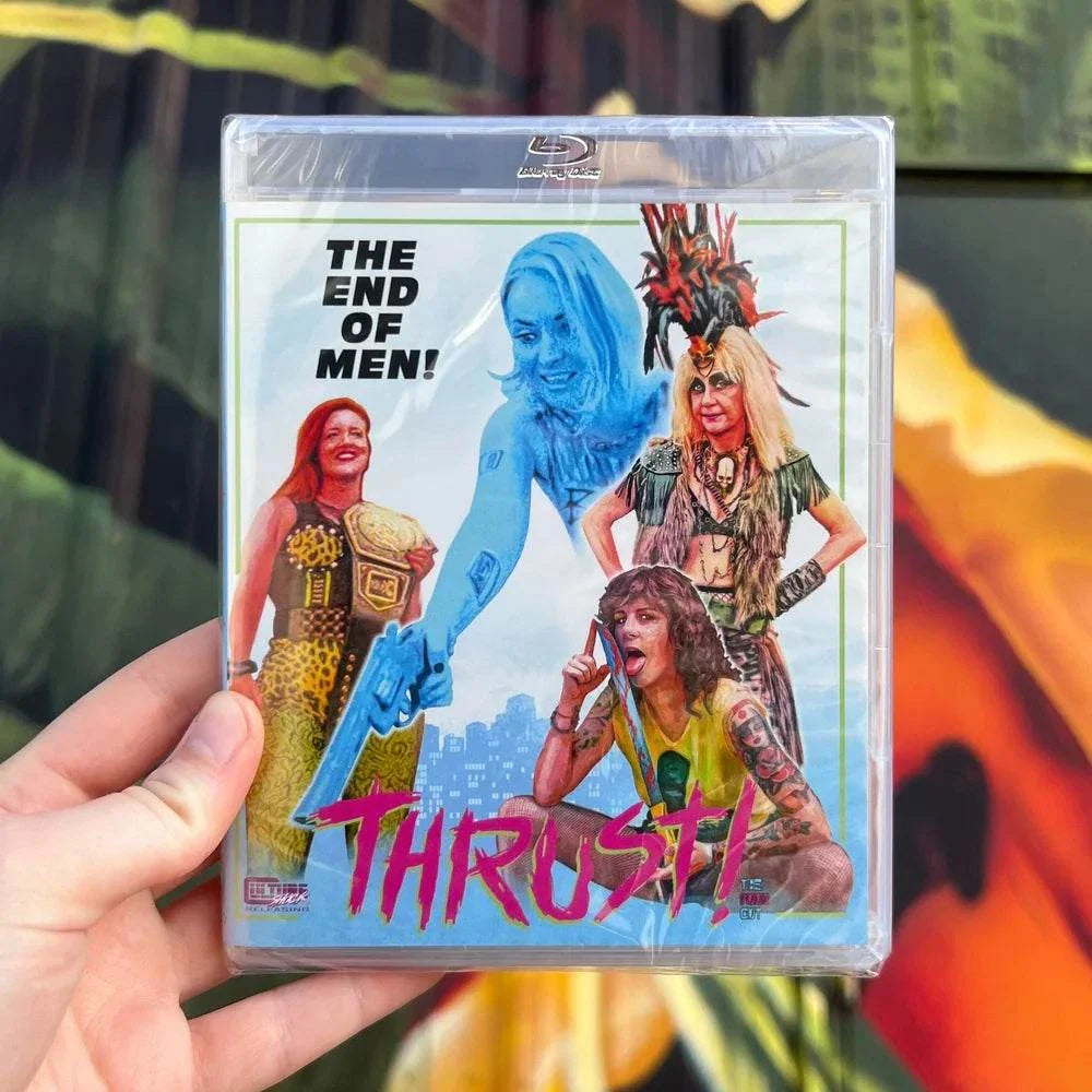 Hand holding Thrust! (The Punk Cut!) Blu-ray with slipcover featuring punk-themed cover art and tagline The End of Men