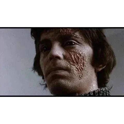 Vinegar Syndrome Labs Blu-Ray of Neither the Sea Nor the Sand with slipcover, featuring haunting scene from the film.