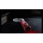 Bloodied severed arm in a horror scene from "Rabid Grannies" film on Blu-Ray.