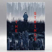 The Strings Blu-Ray with slipcover featuring winter scene artwork.