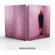 Babygirl Limited Edition 4K Ultra HD Steelbook with decorative pink cover featuring a woman standing by a wall.