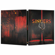 Sinners Limited Edition UK Steelbook 4K Ultra HD and Blu-Ray cover with dark red and black design featuring a man holding a gun against a background with the title "Sinners"
