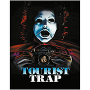 Cover art of Tourist Trap Limited Edition Blu-Ray featuring a creepy mannequin face holding a camera with a reflected image of a female character, dark horror theme
