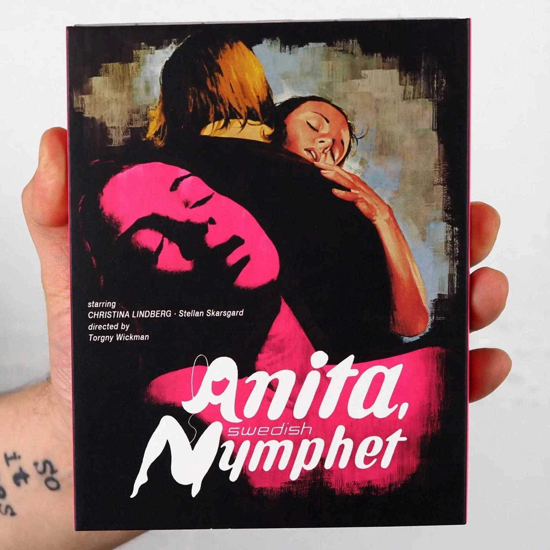 Hand holding Klubb Super 8 Anita Swedish Nymphet Blu-Ray with slipcover featuring artistic cover design.