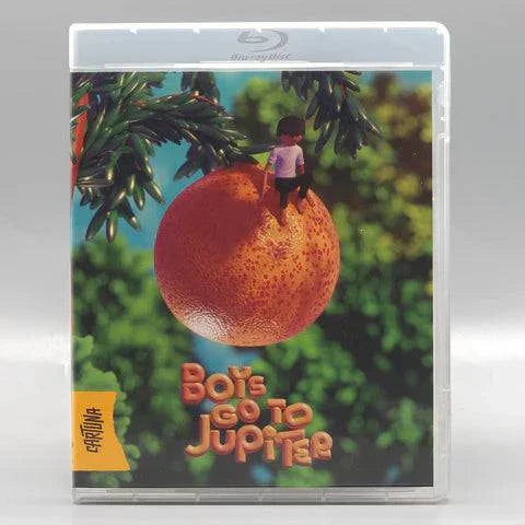 Boys Go to Jupiter Blu-Ray with limited edition slipcover featuring animated boy sitting on large orange fruit against green foliage background.