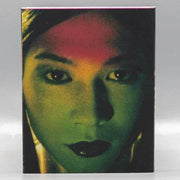 Bye Bye Love Blu-Ray limited edition slipcover with artistic close-up of a woman's face in green and red tones