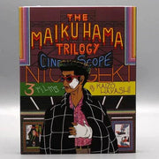Kani - The Maiku Hama Trilogy Blu-Ray cover featuring illustrated detective character in black checkered coat and red sunglasses.