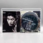 Kani - The Maiku Hama Trilogy Blu-Ray disc with black and white detective image and limited edition slipcover inside case