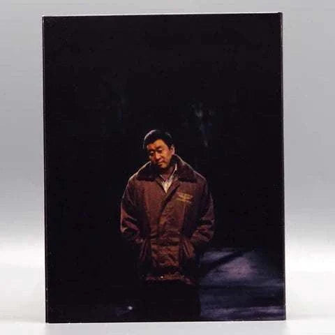 KimStim Only the River Flows Blu-Ray slipcover featuring a man standing alone in dark atmosphere.