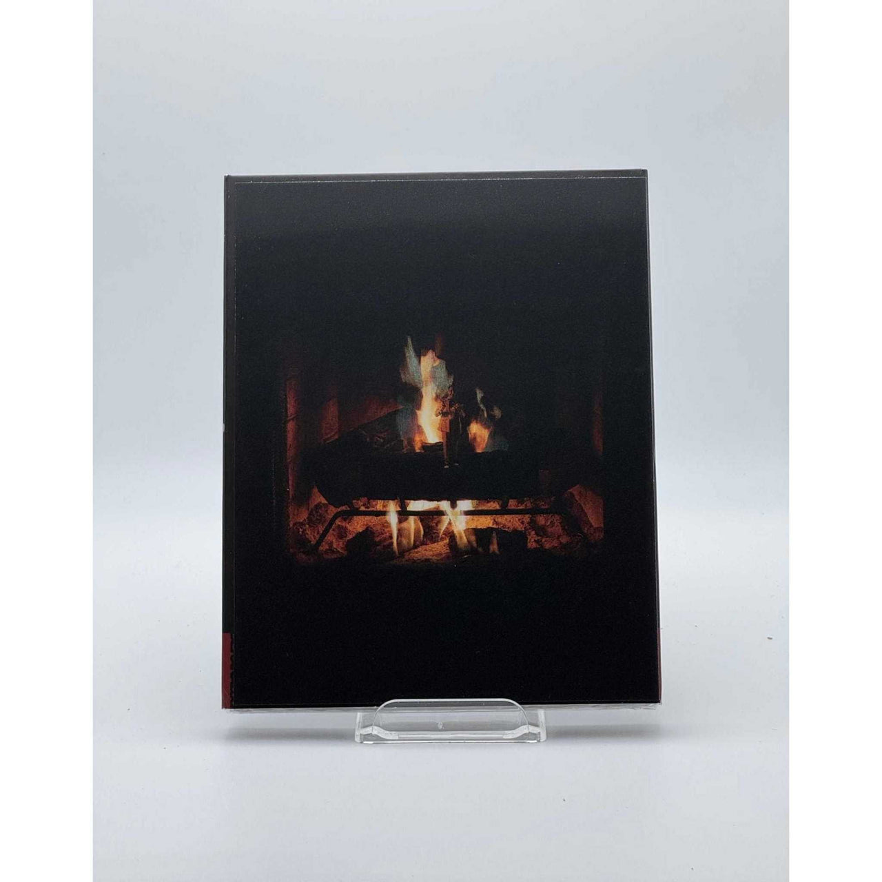 Dekanalog Adult Swim Yule Log Blu-Ray with lenticular slipcover featuring a cozy crackling fire design
