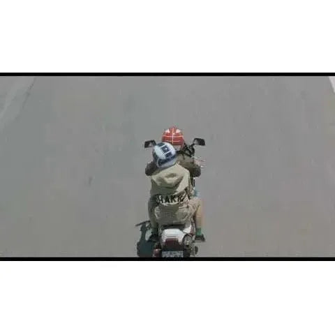 Film Movement - Takeshi Kitano Double Play Blu-ray scene featuring two helmeted riders on a motorcycle.