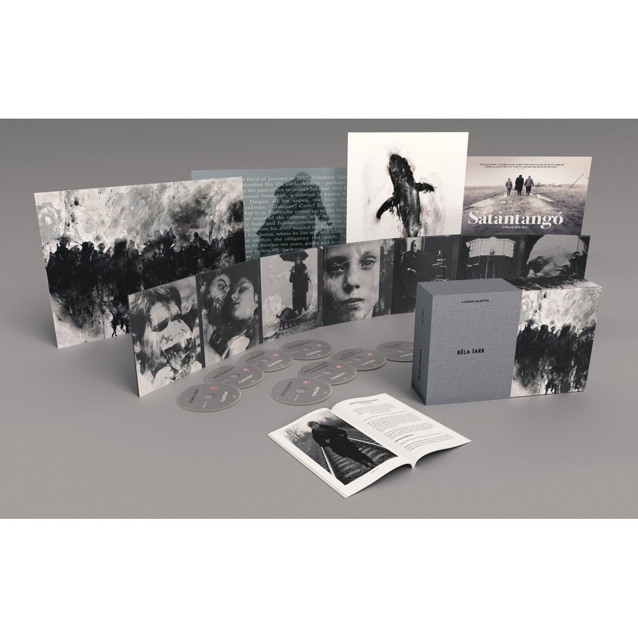 Béla Tarr limited edition 8-disc Blu-ray box set with artwork, posters, and booklet displayed on grey background