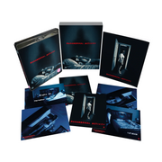 Paranormal Activity Limited Edition Blu-Ray with slipcase, art cards, and booklet featuring horror film scenes.