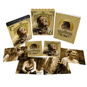 The Sacrament Limited Edition Blu-Ray with rigid slipcase, 70-page book, and collector's art cards laid out.