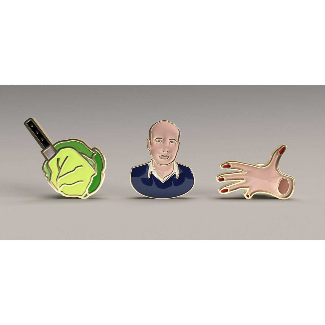 Set of three enamel pins featuring a cleaver in cabbage, a bald man in a blue shirt, and a hand with red nails from Peter Strickland collection.