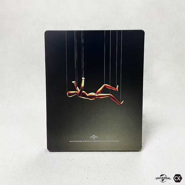 The Game Blu-Ray Limited Edition Steelbook with full slip cover featuring a puppet figure suspended by strings on a black background
